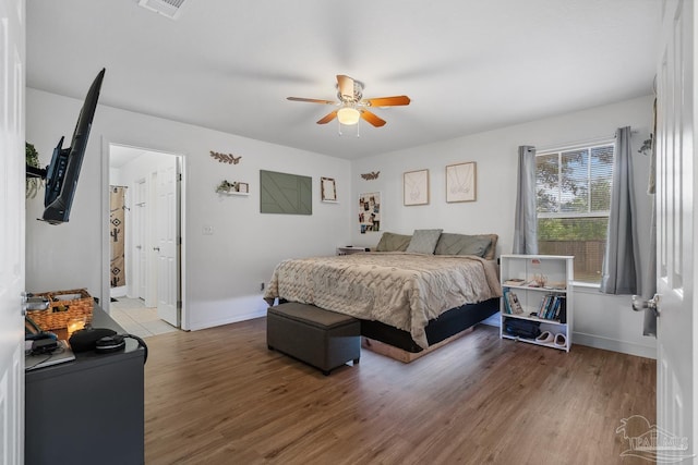 80 Woodland St, Cantonment, FL 32533 - bedroom with wood finished floors, baseboards, and ceiling fan
