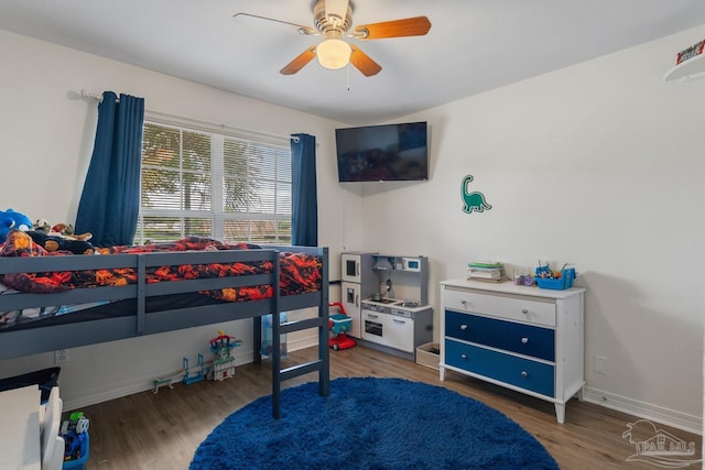 80 Woodland St, Cantonment, FL 32533 - bedroom with wood finished floors, ceiling fan, and baseboards