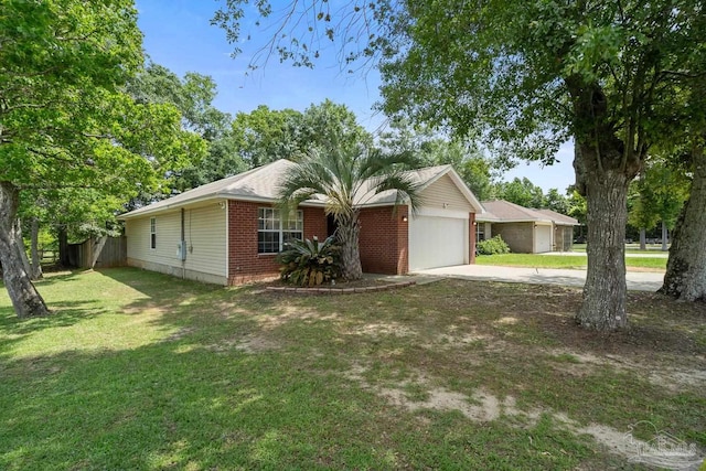 80 Woodland St, Cantonment, FL 32533 - ranch-style house with concrete driveway, an attached garage, and brick siding