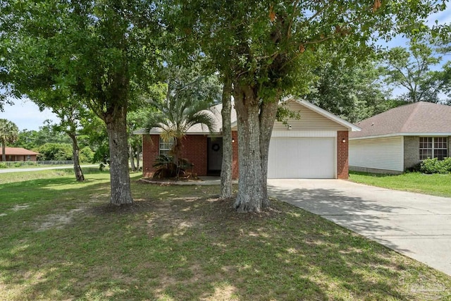 80 Woodland St, Cantonment, FL 32533 - view of front of home with concrete driveway, a garage, a front lawn, and brick siding