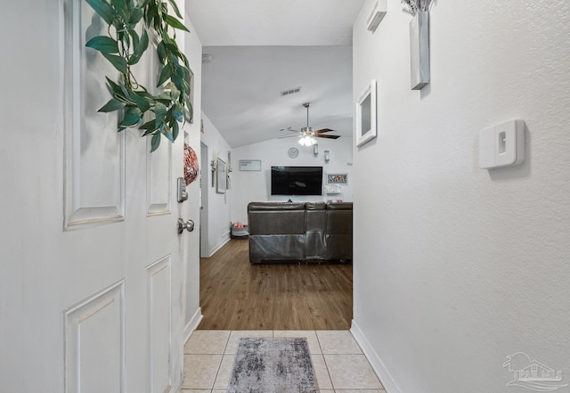 80 Woodland St, Cantonment, FL 32533 - hall featuring vaulted ceiling, baseboards, and light tile patterned flooring