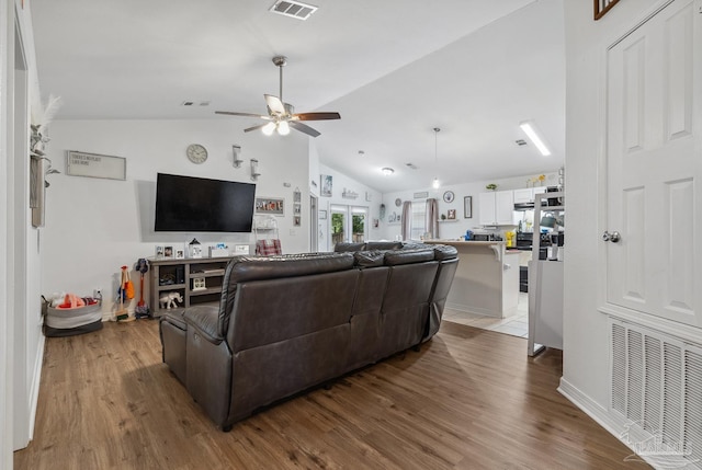 80 Woodland St, Cantonment, FL 32533 - living area with a ceiling fan, wood finished floors, lofted ceiling, and baseboards