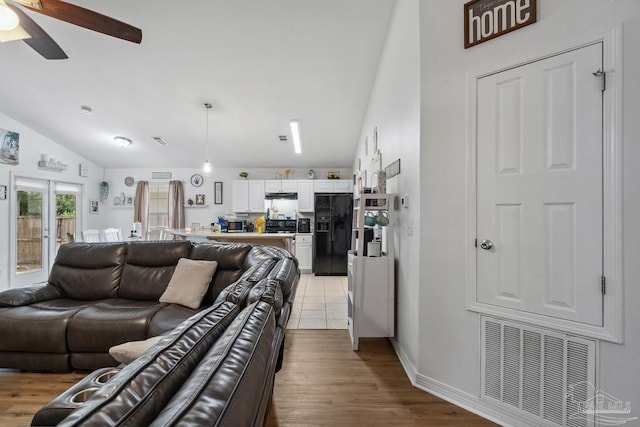 80 Woodland St, Cantonment, FL 32533 - living area featuring a ceiling fan, lofted ceiling, wood finished floors, and baseboards