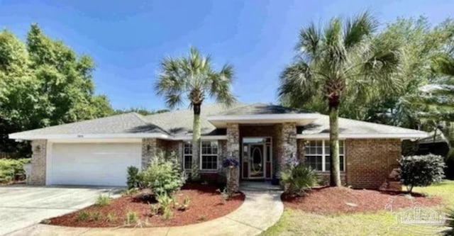 single story home featuring an attached garage and concrete driveway