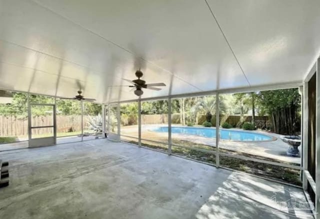 exterior space featuring a ceiling fan, a fenced backyard, a fenced in pool, and a patio