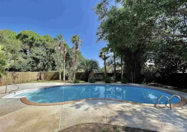 view of swimming pool with a patio, a fenced in pool, and a fenced backyard