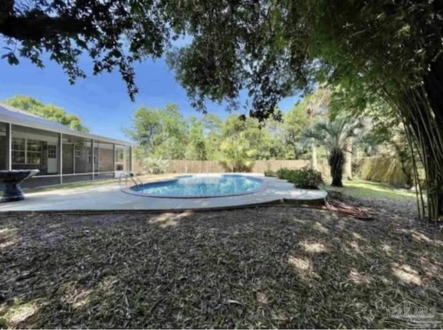 view of yard featuring a fenced backyard and a fenced in pool