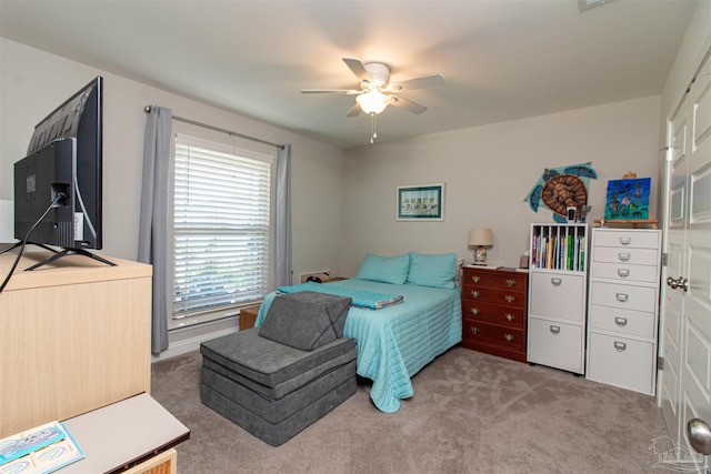 bedroom with ceiling fan and carpet flooring