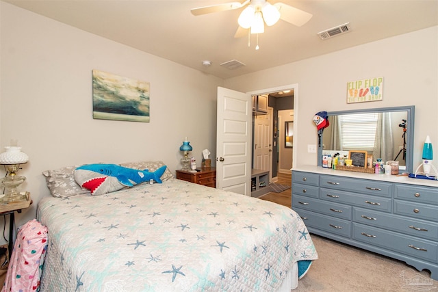 bedroom featuring ceiling fan and light colored carpet