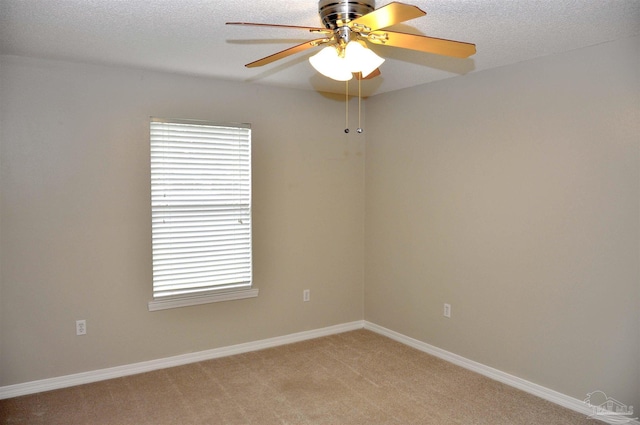 1701 Eagle Ter, Cantonment, FL 32533 - unfurnished room featuring a ceiling fan, baseboards, light colored carpet, and a wealth of natural light