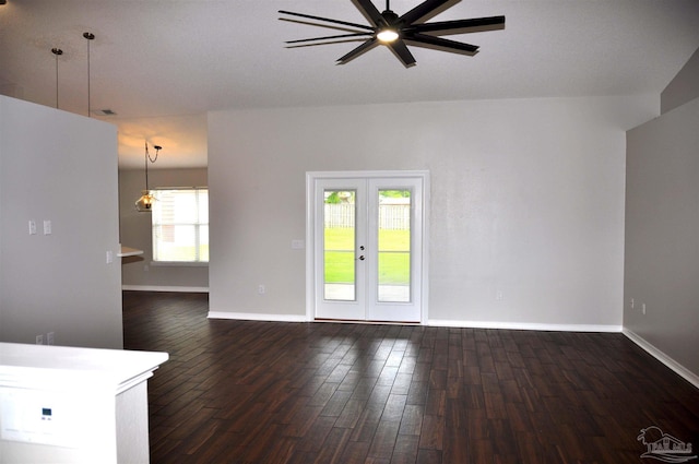 1701 Eagle Ter, Cantonment, FL 32533 - unfurnished living room with a ceiling fan, baseboards, french doors, and dark wood-type flooring