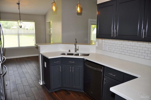 1701 Eagle Ter, Cantonment, FL 32533 - kitchen with a peninsula, lofted ceiling, dark wood-style floors, a sink, and dishwasher