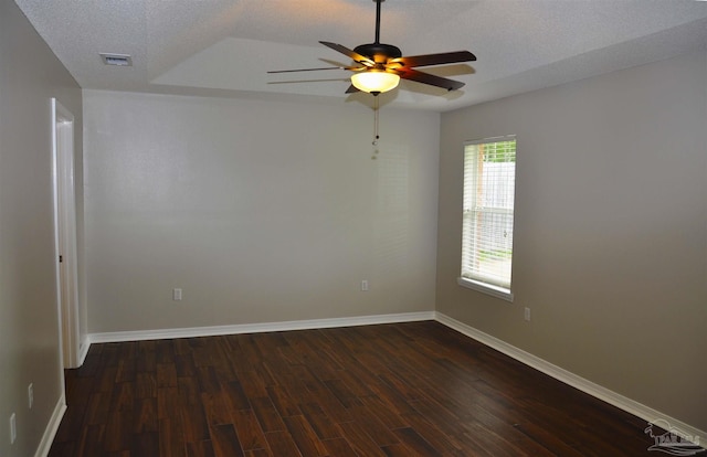 1701 Eagle Ter, Cantonment, FL 32533 - unfurnished room featuring dark wood-type flooring, a ceiling fan, baseboards, and a textured ceiling
