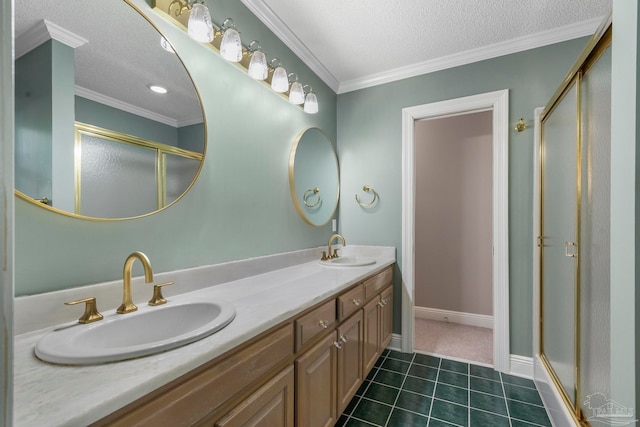 bathroom featuring dual vanity, crown molding, a textured ceiling, and tile patterned flooring