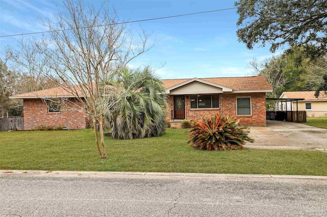 single story home featuring a carport and a front lawn