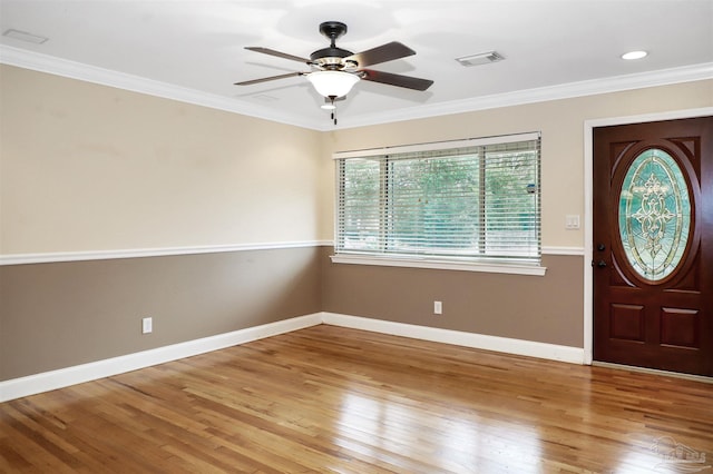 entryway featuring ornamental molding, ceiling fan, and light hardwood / wood-style floors