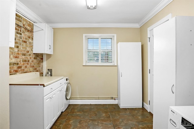 kitchen featuring ornamental molding, washer / dryer, and white cabinets