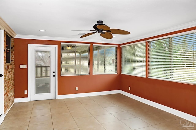 unfurnished sunroom with ceiling fan