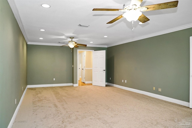 interior space featuring light colored carpet, ornamental molding, and ceiling fan