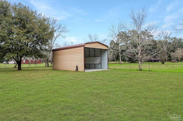 view of outbuilding featuring a lawn