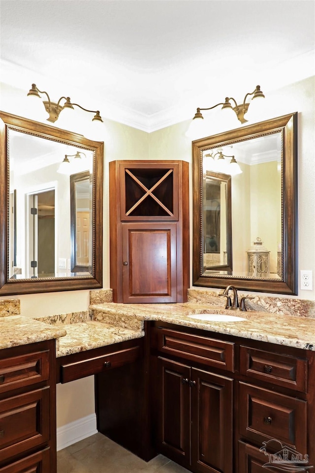 bathroom featuring vanity and crown molding