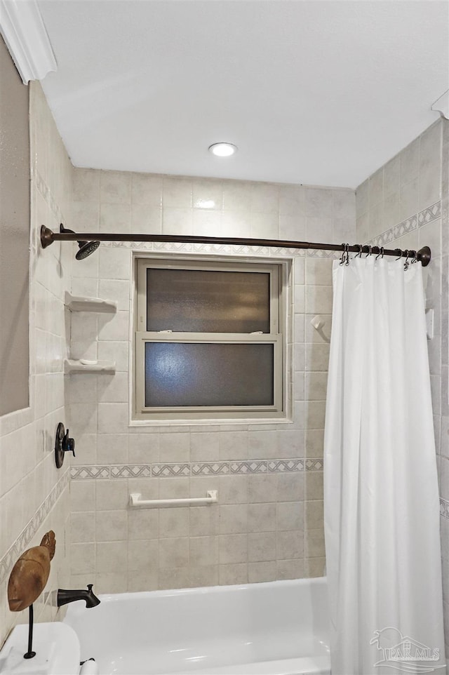 bathroom with shower / bathtub combination with curtain