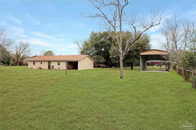 view of yard with a carport