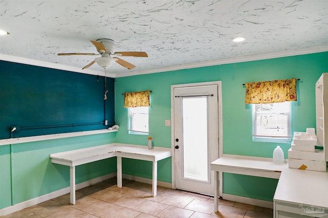 unfurnished office featuring crown molding, light tile patterned flooring, and ceiling fan