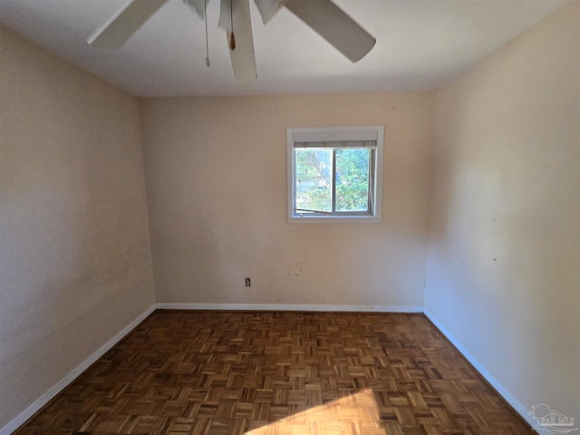 unfurnished room with dark parquet flooring