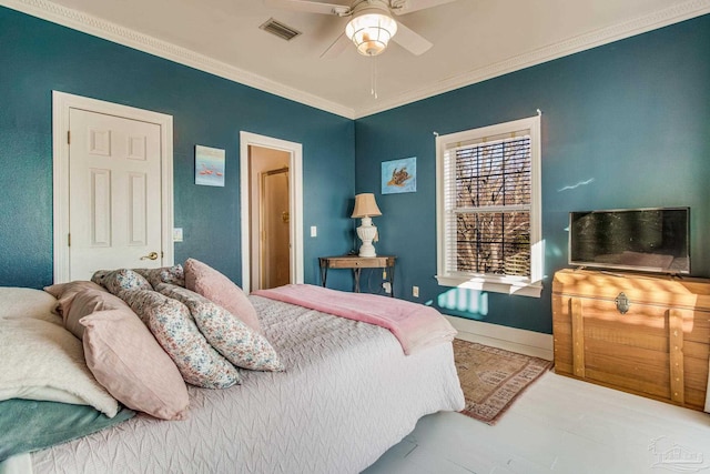 bedroom with ceiling fan and crown molding