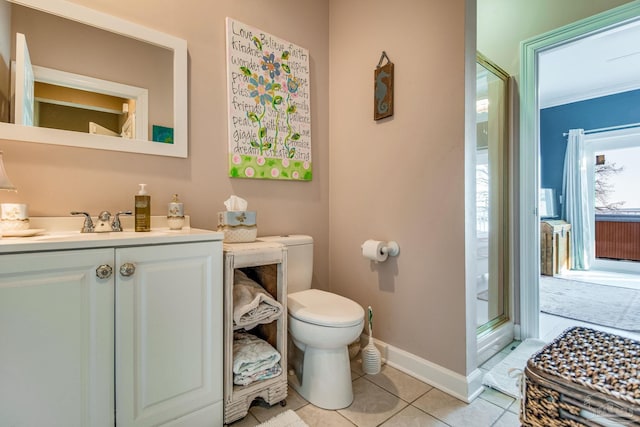 bathroom with toilet, walk in shower, ornamental molding, tile patterned floors, and vanity