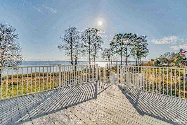 wooden deck featuring a water view