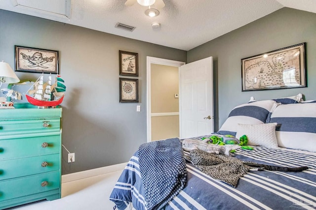 bedroom featuring a textured ceiling