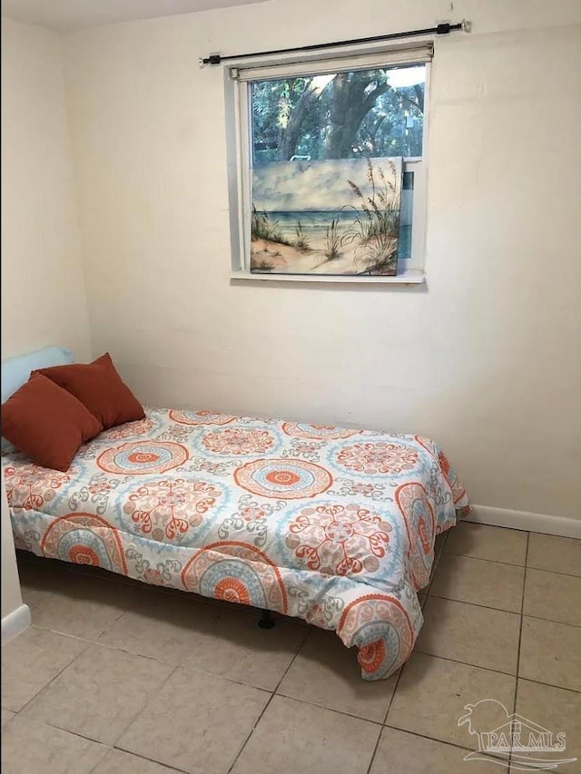 bedroom with tile patterned floors