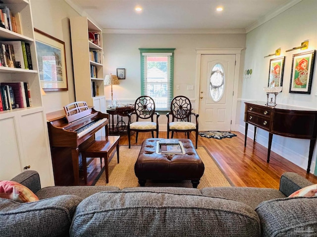 sitting room featuring light hardwood / wood-style floors and ornamental molding