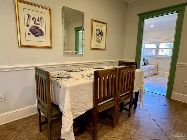 dining room with dark tile patterned floors