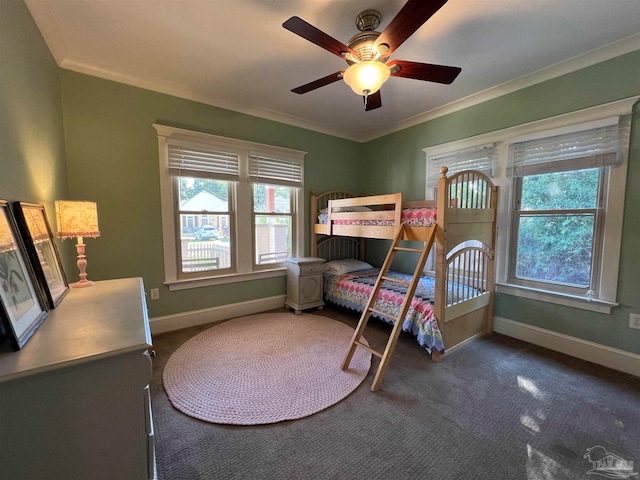 bedroom featuring ornamental molding, multiple windows, carpet floors, and ceiling fan