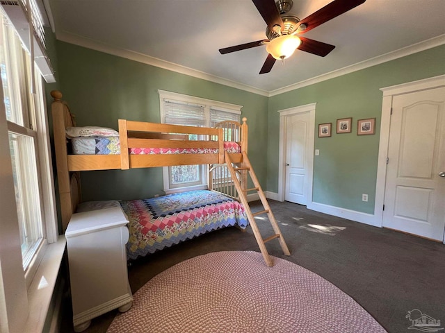 bedroom with ceiling fan, crown molding, and dark colored carpet