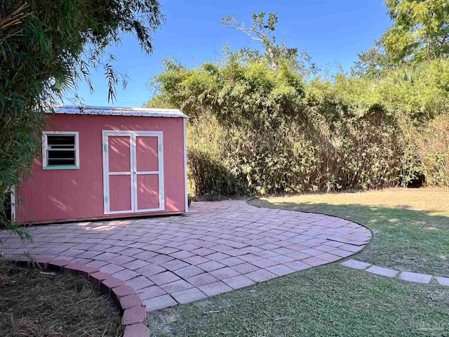 view of outdoor structure with a lawn