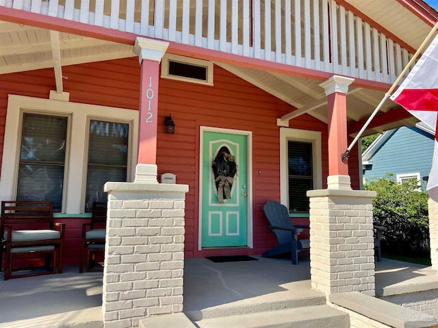 entrance to property with a porch