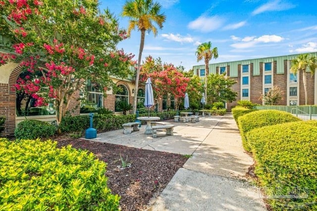 view of property's community featuring a patio area