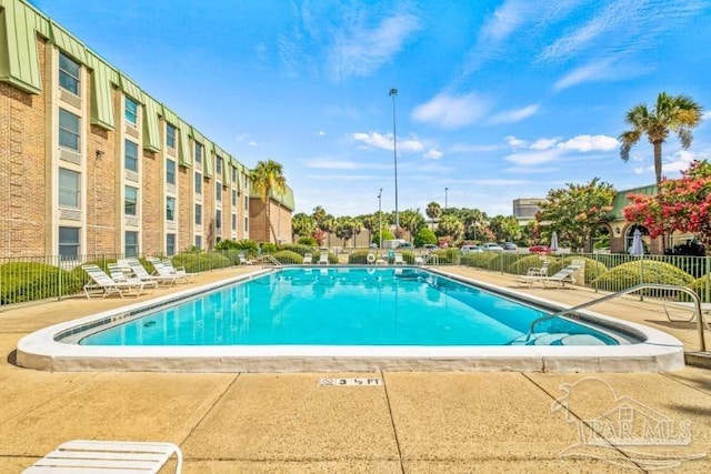 view of swimming pool featuring a patio area