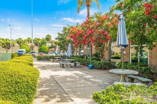 view of property's community with a patio area