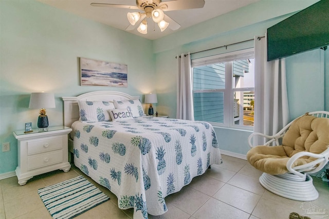 bedroom with ceiling fan and light tile patterned flooring