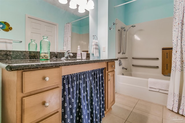 bathroom with shower / bath combo, tile patterned floors, and vanity