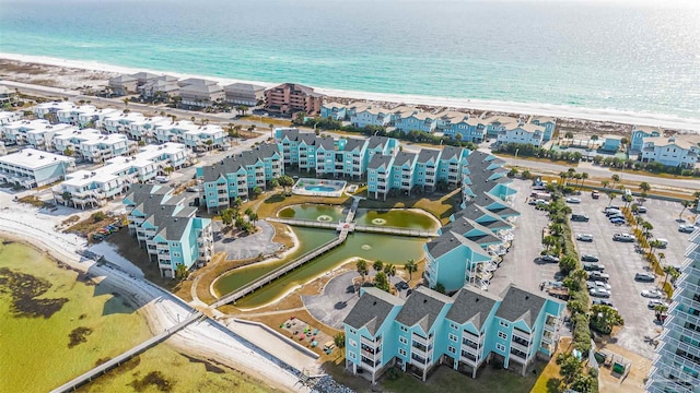 bird's eye view with a water view and a view of the beach