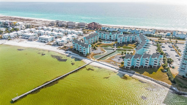 birds eye view of property featuring a view of the beach and a water view