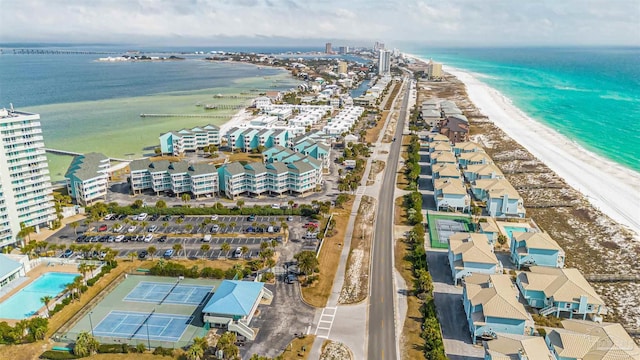 aerial view with a water view and a beach view