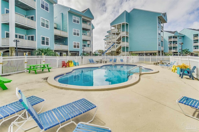 view of swimming pool featuring a patio area