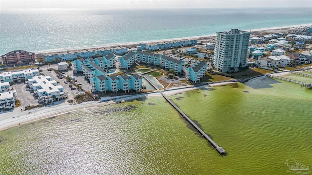 bird's eye view with a water view and a view of the beach